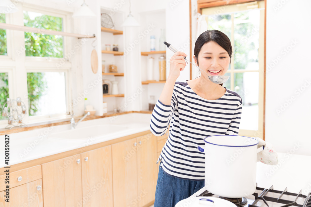 attractive asian woman in the kitchen attractive asian woman in the kitchen