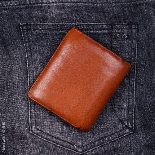 brown wallet on black jean
