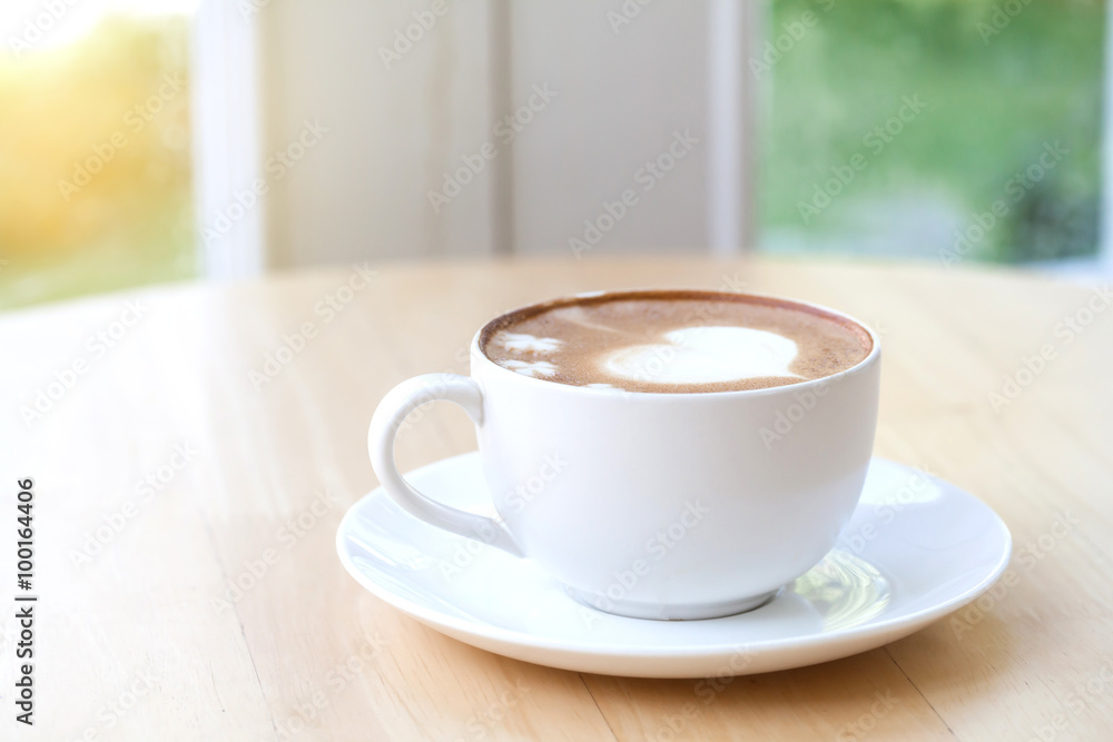 heart symbol on latte coffee cup on table heart symbol on latte coffee cup on table