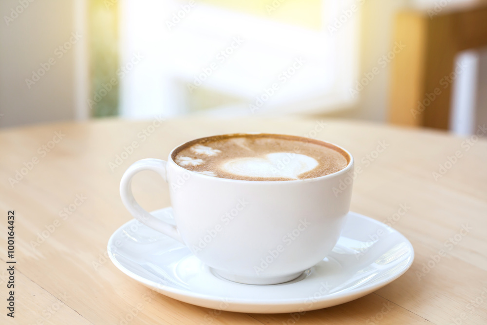 heart symbol on latte coffee cup on table heart symbol on latte coffee cup on table