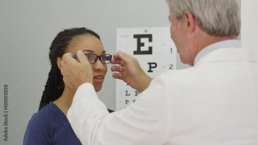 Black woman trying on her new glasses