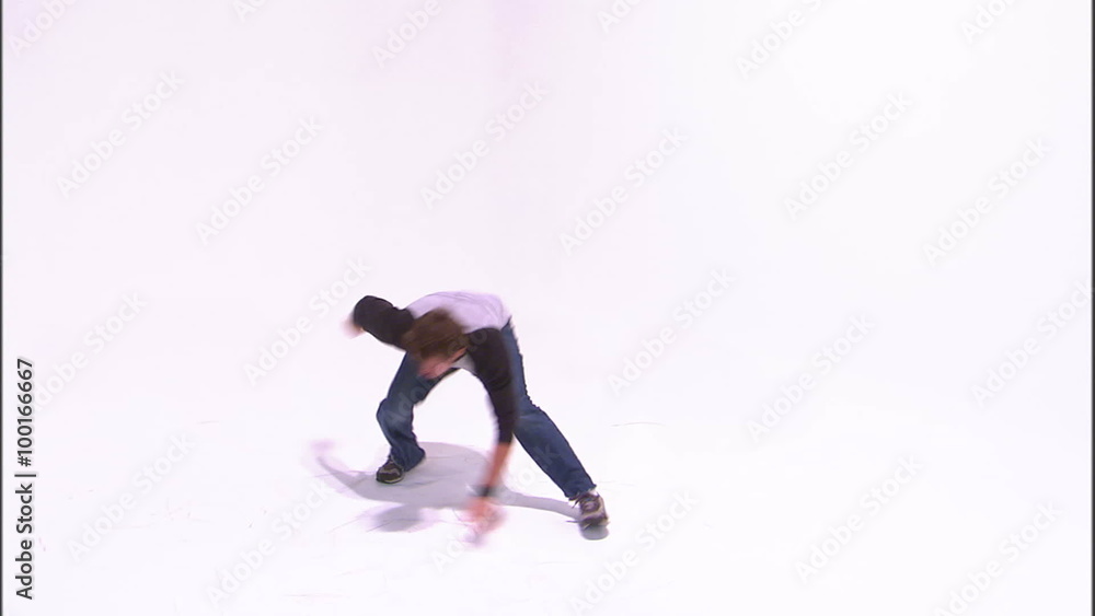 Break dancer dancing on the ground on a white background. Break dancer dancing on the ground on a white background.