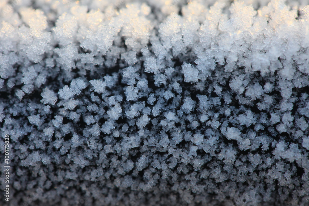 Crystals of frost on a cast iron surface closeup Crystals of frost on a cast iron surface closeup