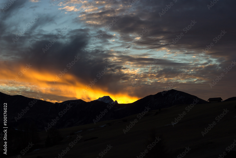 Mountain views of Alpe di Siusi with red sunrise Mountain views of Alpe di Siusi with red sunrise