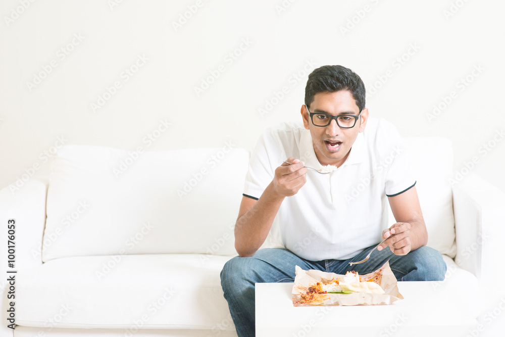 Lonely single man eating food alone Lonely single man eating food alone