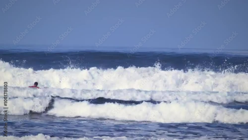 Shot of a man playing in the ocean at the Costa Rican coastline Shot of a man playing in the ocean at the Costa Rican coastline