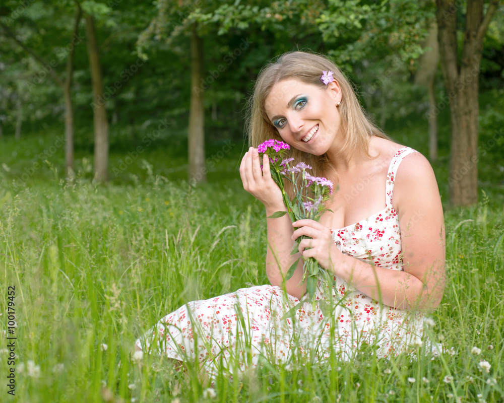 Woman with flowers in nature Woman with flowers in nature
