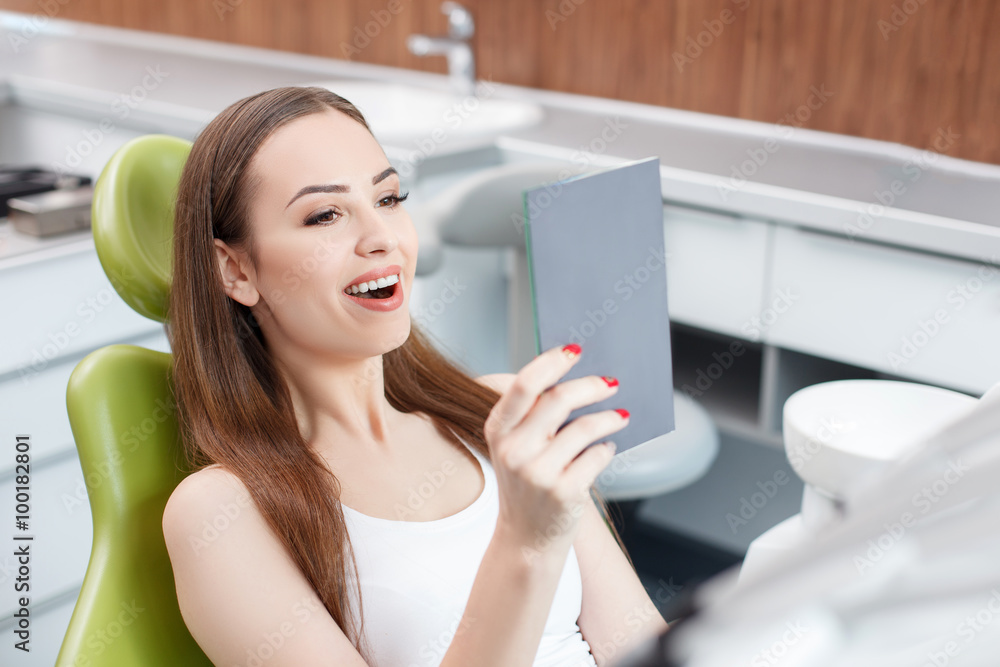Attractive young girl is visiting her dentist Attractive young girl is visiting her dentist