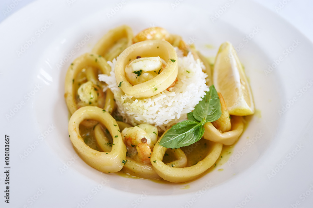 Shrimp, squid in curry sauce and white rice Shrimp, squid in curry sauce and white rice