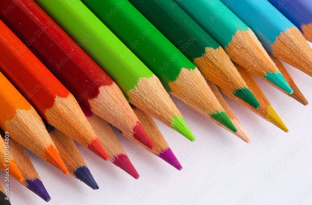 Colourful pencils on a white surface.Close up Colourful pencils on a white surface.Close up