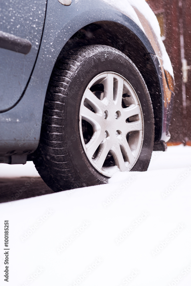 Naklejka premium Tire at snow. Winter. Shallow depth of field.