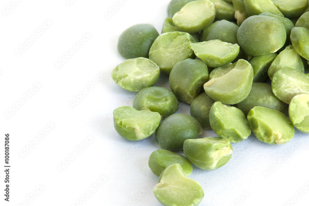Dried green peas on a white surface Dried green peas on a white surface