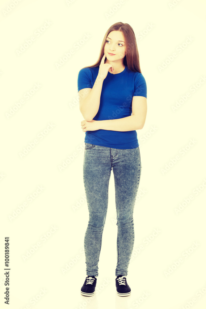 Fototapeta premium Beautiful thoughtful woman looking up.