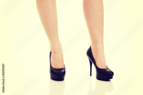 Woman legs with black sexy shoes. .