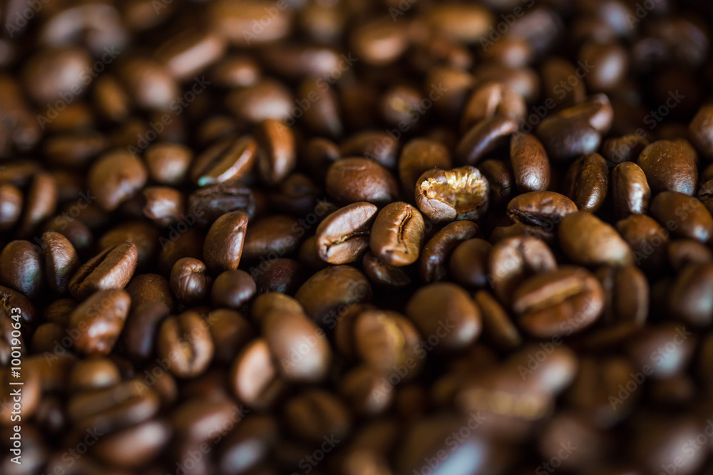 Selective focus of brown roasted coffee bean Selective focus of brown roasted coffee bean