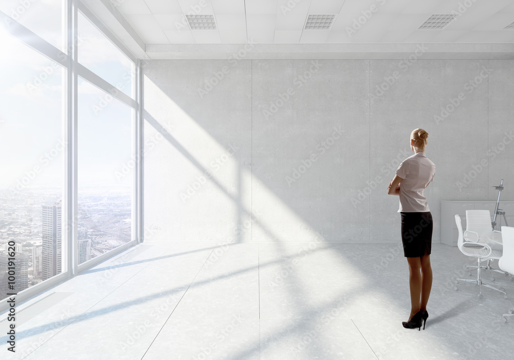 Businesswoman in top floor office Businesswoman in top floor office