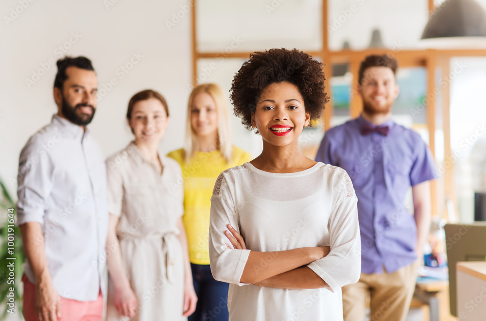 happy young woman over creative team in office happy young woman over creative team in office