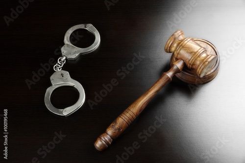 Real Judges Gavel And Handcuffs On The Black Table