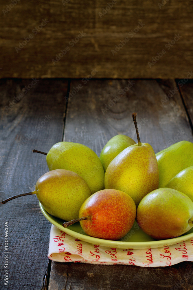 Fresh juicy pears on a table in a rustic style