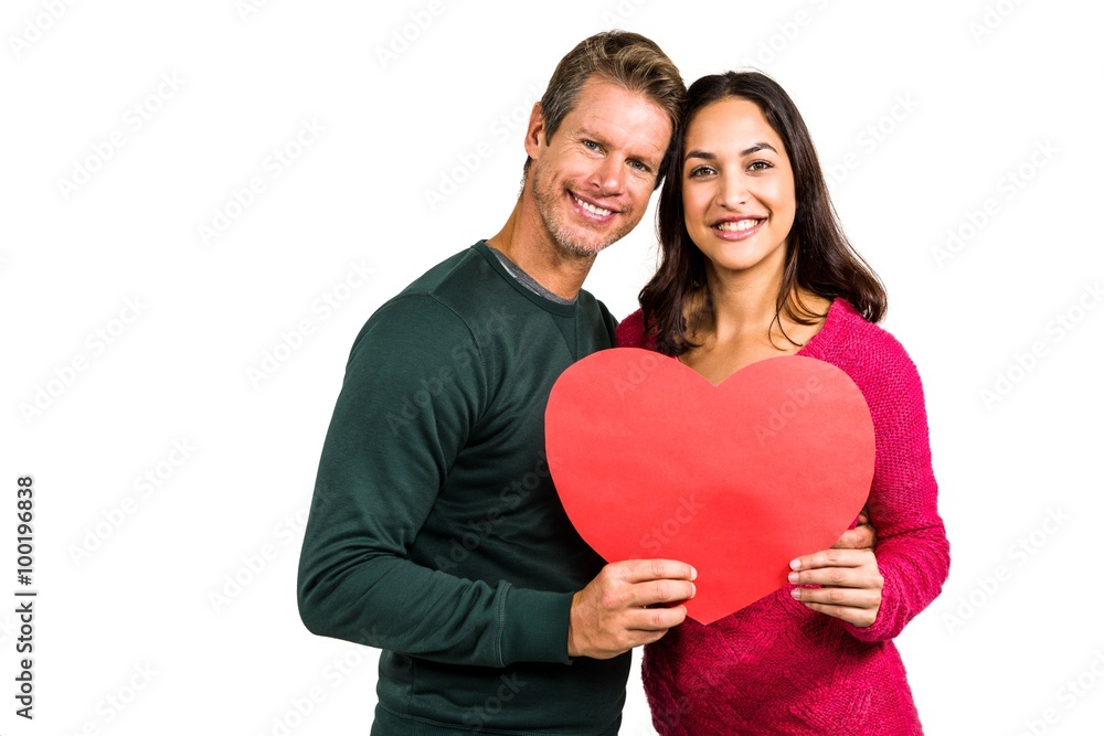 Portrait of smiling couple holding heart shape Portrait of smiling couple holding heart shape