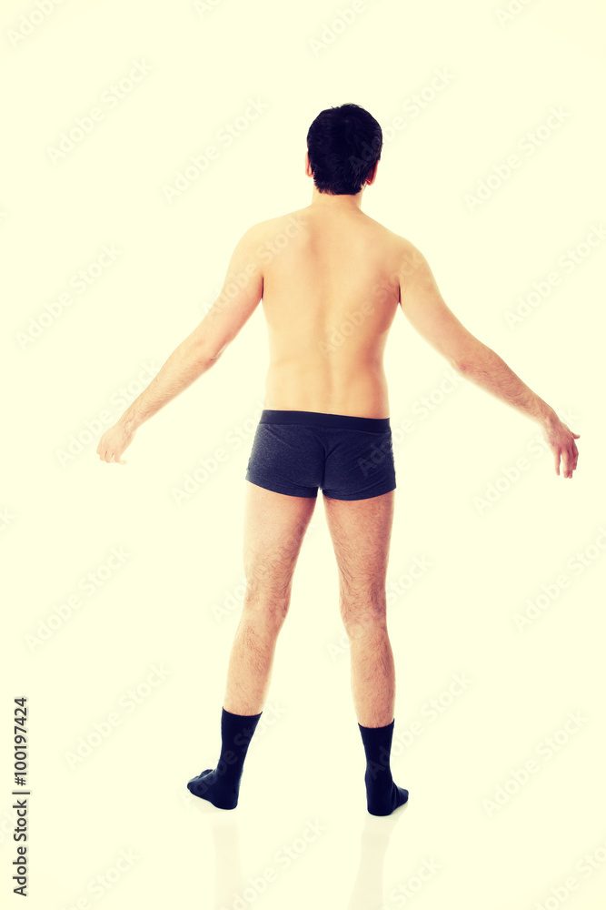 Fototapeta premium Young shirtless man with arms wide open.