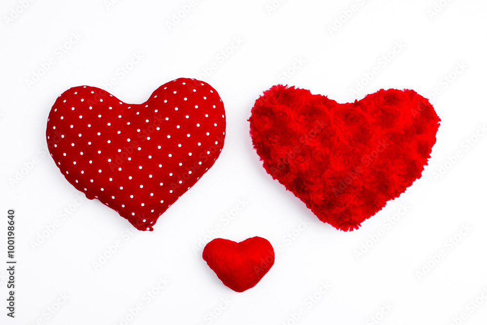 Three red valentine hearts isolated on white