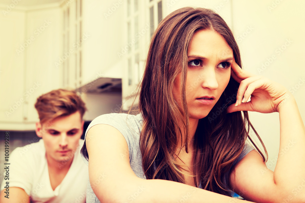 Fototapeta premium Couple having an argument in the kitchen.