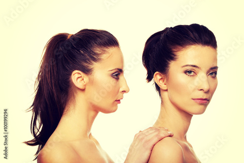 Beauty woman standing behind her friend.