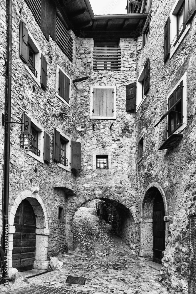 Narrow alley in a medieval village in Italy.