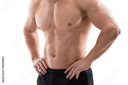 Muscular Man Standing With Hands On Hip