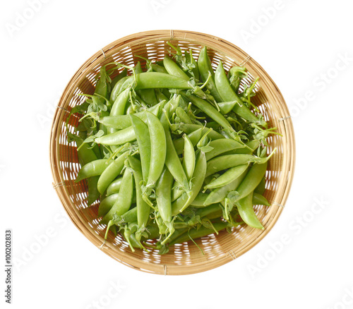 Sweet peas,Bamboo basket on white background.