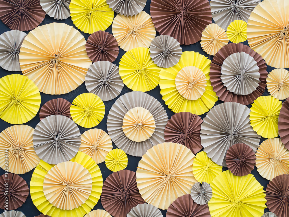 Colorful paper flower on board