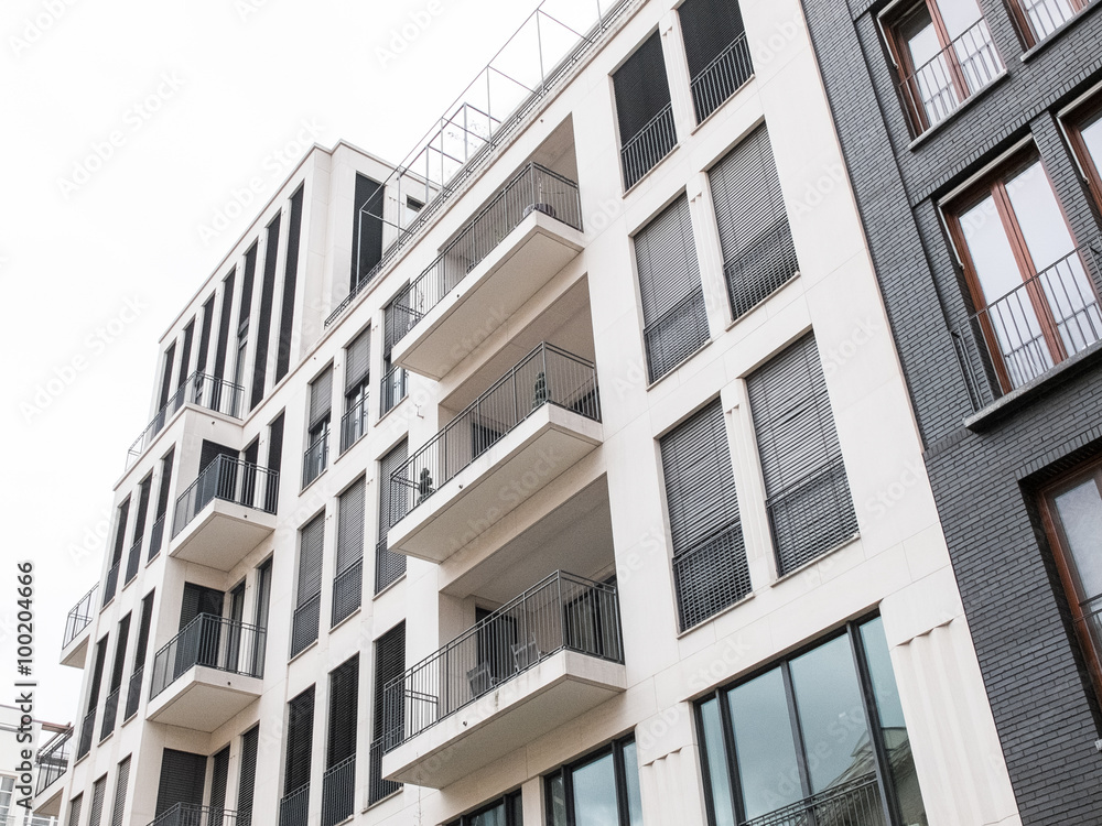 Looking up view of apartments with balconies