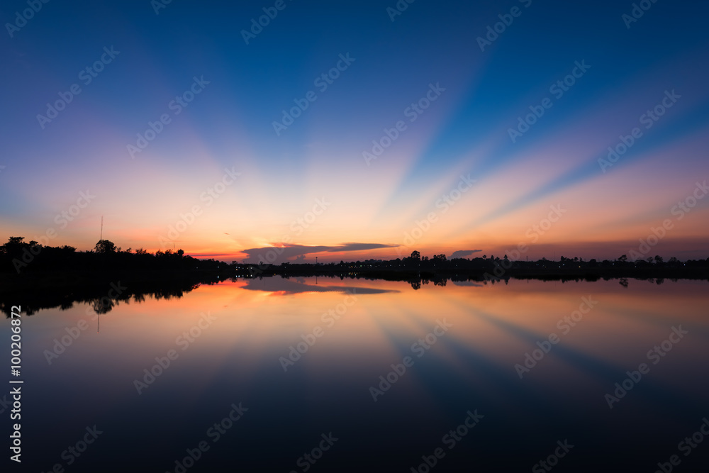 Landscape of calm lake at sunset
