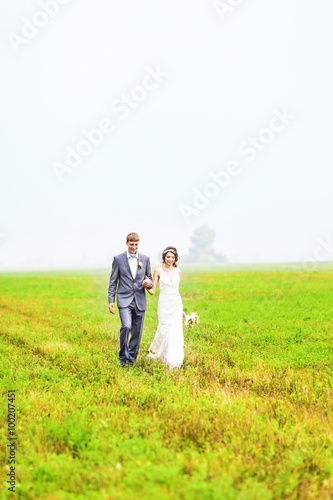 young wedding couple, beautiful bride with groom portrait, summer nature outdoor © satura_