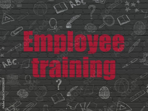 Learning concept: Employee Training on wall background