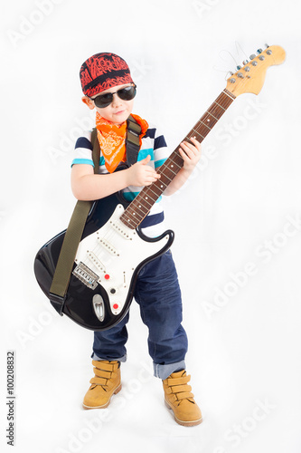 Rocker boy with electric guitar, isolated on white background 