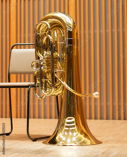 Golden tuba in the concert hall.Wind instrument. Copper musical instrument
 photo