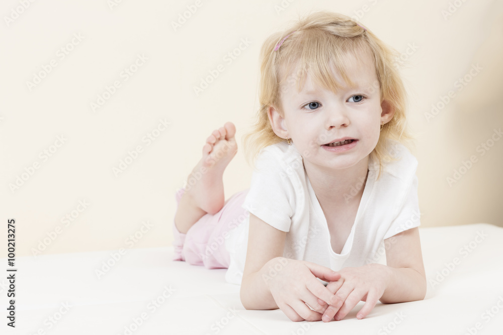 portrait of lying little girl