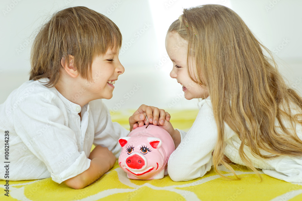 kids with piggy bank kids with piggy bank