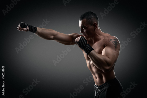 Fighter boxer on black background