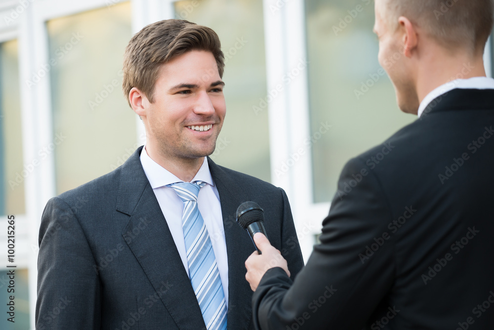 Journalist Taking Interview Of Happy Businessman Journalist Taking Interview Of Happy Businessman