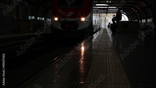 Slow motion shot of an arriving train in Italy photo