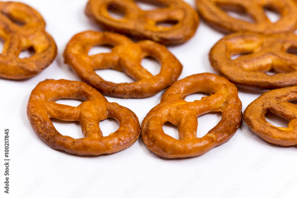 Pile of pretzels on a white surface