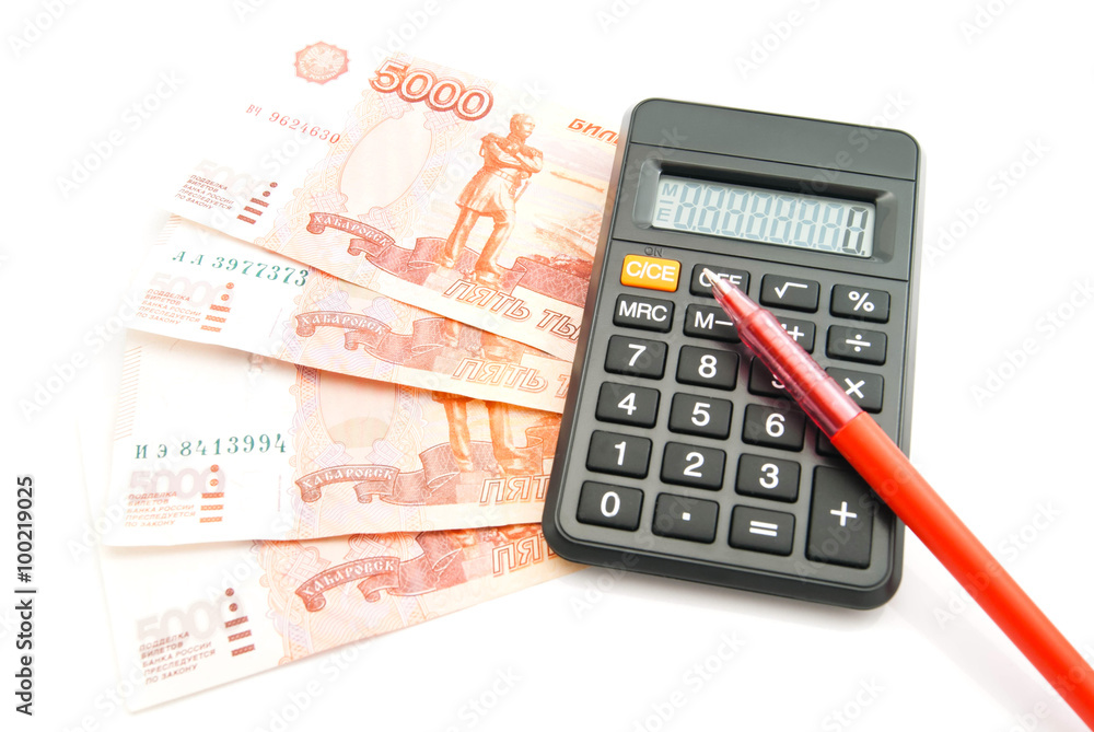 Russian banknotes, pen and calculator on white Russian banknotes, pen and calculator on white