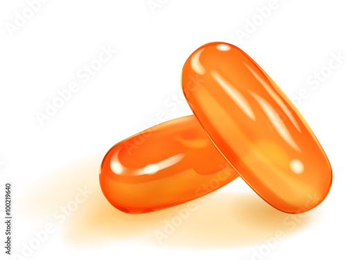 Two orange capsules with shadows on white background