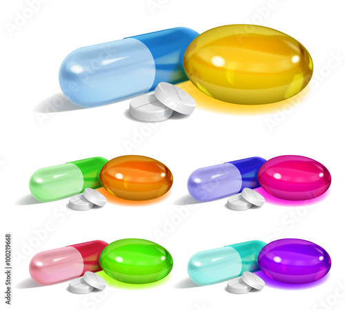 Set of oblong and elliptical multicolored capsules and white round pills with shadows on white background