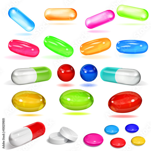 Set of various opaque multicolored capsules and pills on white background