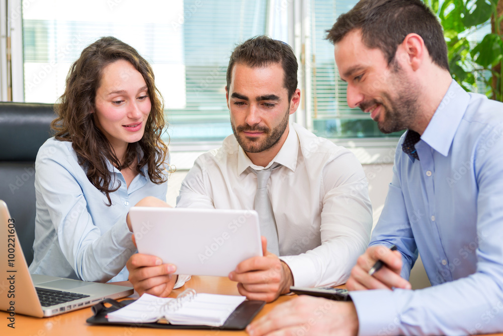 Fototapeta premium Group of business associates working together at the office