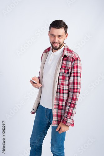 Young smiling guy with a phone
